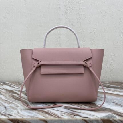 CELINE BELT MINI mini grained calf leather handbag with 1 leather handle, 1 detachable shoulder strap and 1 zipped pocket on the outside back. This handbag features two closure options: top flap and zipper. nSize 11 X 9 X 7 inches (28 X 23 X 17 cm)n100% Calfskin leathern100% Calfskin leather liningnGolden metal hardwarenShoulder or handheldnMagnetic snap top flap closure and top flap lower zipper closurenInterior double flat pocketsnBack exterior flat pocketnDetachable leather shoulder strap 14 inches (36 cm)nTote handle 4 inches (9 cm)n Protective foot studsn No. 175523 P1050
