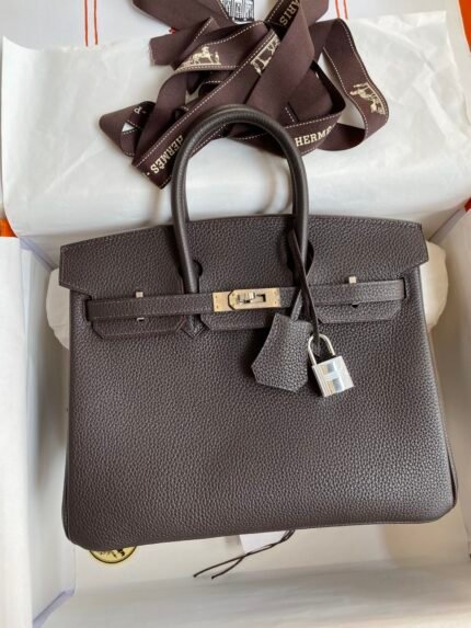 Hermes Fully hand-stitched Birkin 25cm imported togo leather Ebony with gold-brown and silver buckles.
