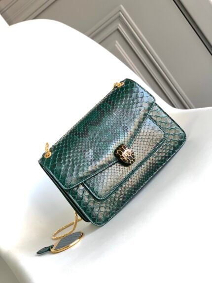 ✨BVLGAR*✨VIP CUSTOMIZED nSerpenti Forever Python Skin New 🐍n🔺Made of noble forest emerald green glossy python skin n🔹Lined with lambskin 🐑nScales come to life in a vivid and natural way n n 🔸 with snake chain shoulder strap, light gold plated brass hardware n Black enamel with black onyx sexy eyes 👀n✔️ featuring  2 ⃣️ compartments, one front and one back patchwork pockets ➕separated zipper pockets, interior open pockets Engraved BULGARI Bulgari brand logo inside metal plaque, n back Engraved BULGARI metal logo n with a personalized make-up mirror n 🎁 with upgraded gold color gift box nSize: 25*16.5*8Cm2903230502